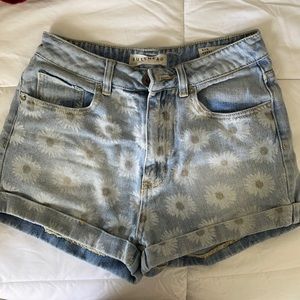 High waist mom shorts with sunflower detail!